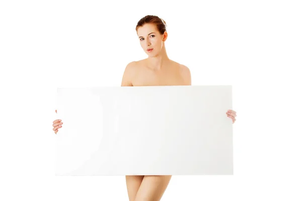 Young woman with empty board. — Stock Photo, Image