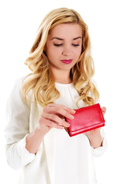 Young woman with empty pocket, on white. — Stock Photo, Image