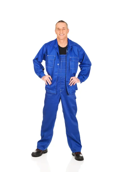 Smiling repairman with hands on hips — Stock Photo, Image