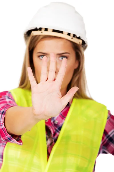 Werknemer vrouw stopbord maken — Stockfoto