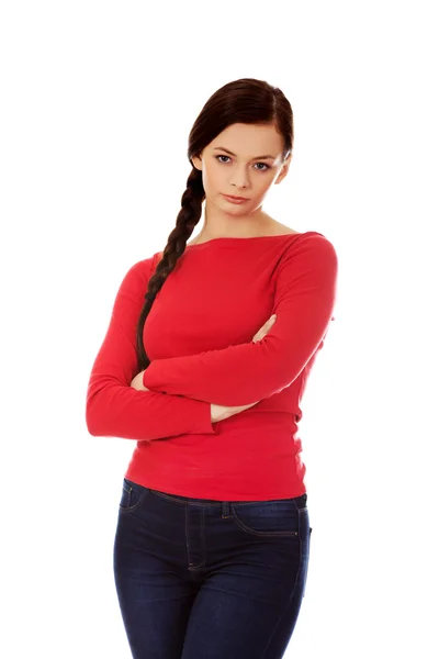 Annoyed young woman with arms crossed — Stock Photo, Image