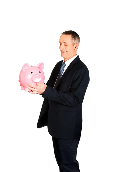 Businessman with big piggybank — Stock Photo, Image