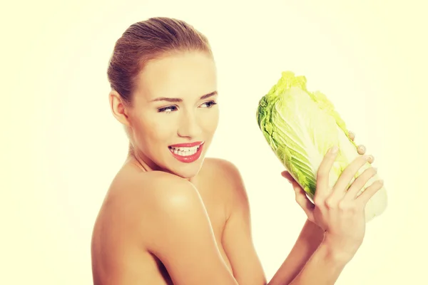 Beautiful woman with iceberg lettuce. — Stock Photo, Image