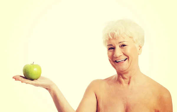 Kobieta trzyma i jabłko — Zdjęcie stockowe