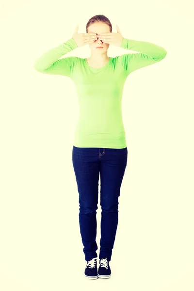 Young teen woman covering her face with hands — Stock Photo, Image