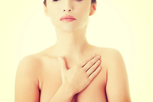 Kobieta dotyka jej piersi — Zdjęcie stockowe