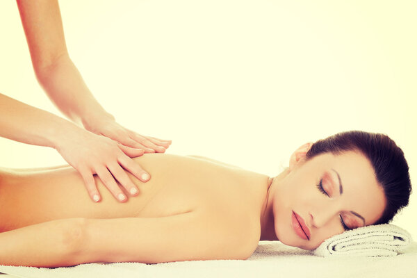 Woman relaxing beeing massaged in spa saloon