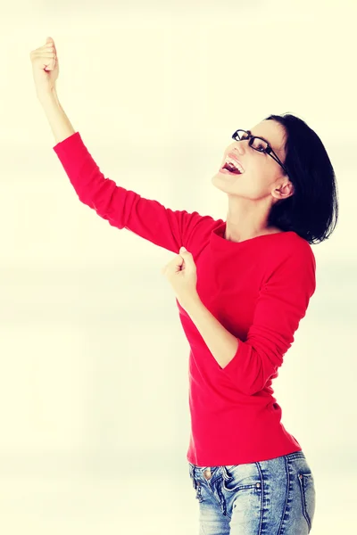 Excited young woman with fists up — Stock Photo, Image