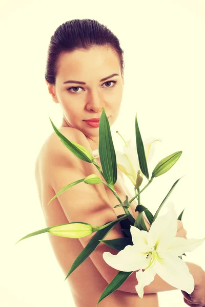 Beautiful topless woman with white lily. — Stock Photo, Image