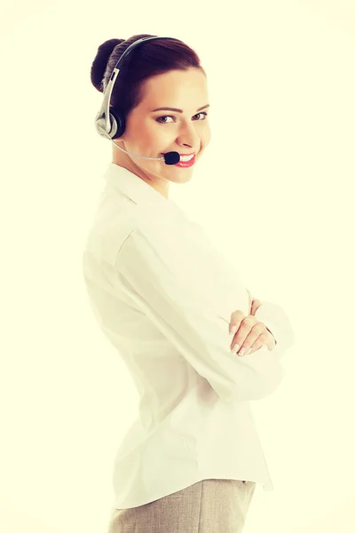 Bella donna in call center con microfono e cuffie . — Foto Stock