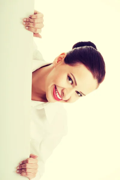 Beautiful young business woman holding copy space. Stock Image