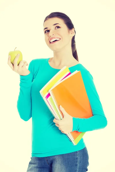 Hermosa joven estudiante con archivos y manzana . — Foto de Stock