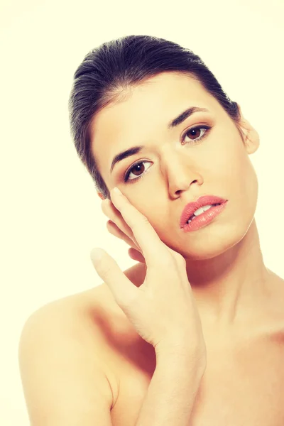 Portrait of beautiful topless woman touching her face. — Stock Photo, Image