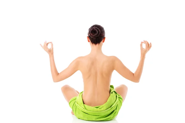 Young nude woman with towel practicing yoga, isolated on white. — Stock Photo, Image