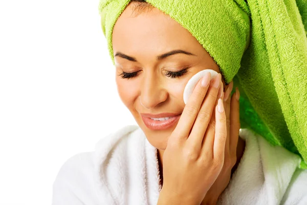 Woman in bathrobe removing makeup — Stock Photo, Image