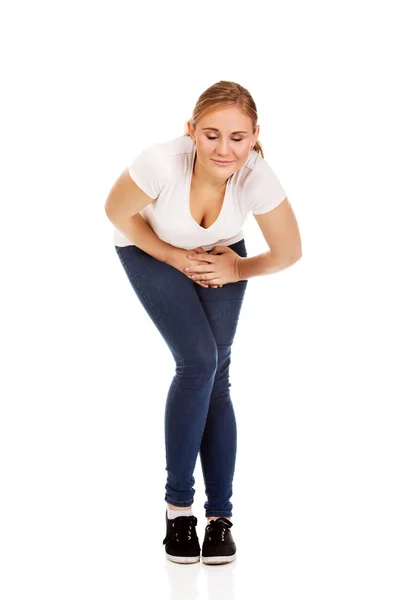 Junge Frau mit Oberschenkelschmerzen — Stockfoto