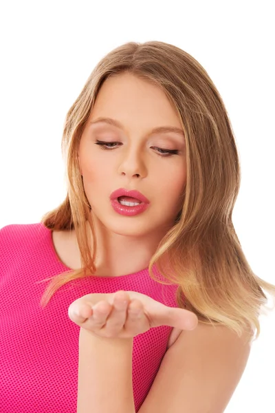 Young blonde woman blowing a kiss — Stock Photo, Image