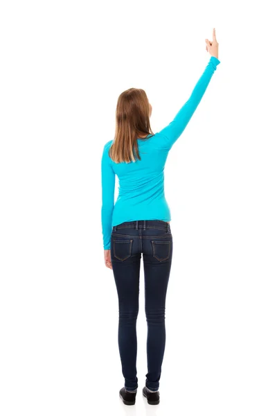 Young woman pointing up — Stock Photo, Image