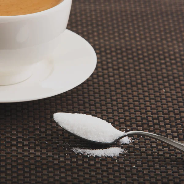 Coffee cup with tea spoon — Stock Photo, Image