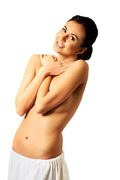 Topless woman wrapped in towel - Stock Image. 