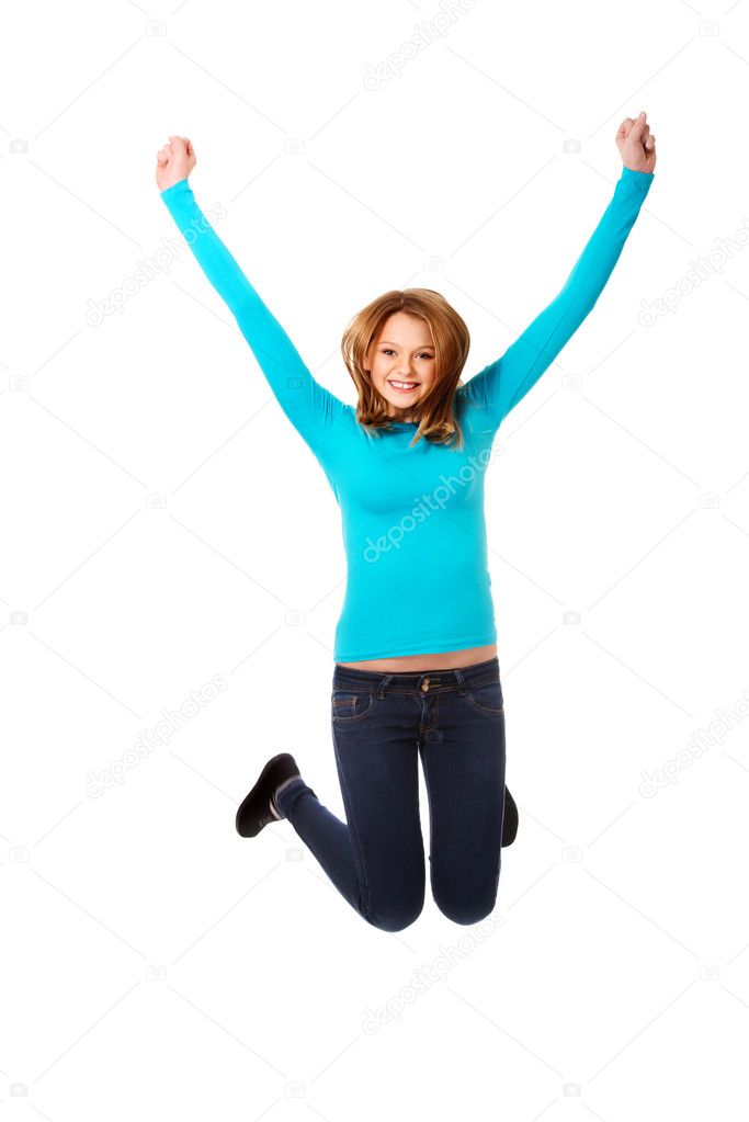 Young woman jumping with joy