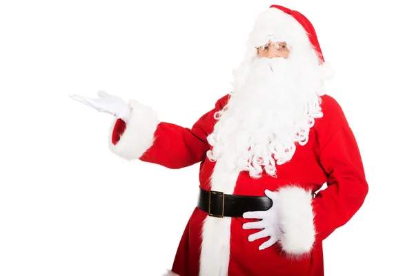 Santa Claus holding something invisible — Stock Photo, Image