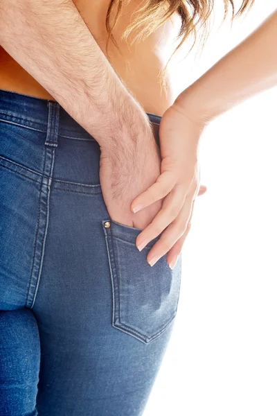 Male hand in womans jeans pocket. — Stock Photo, Image