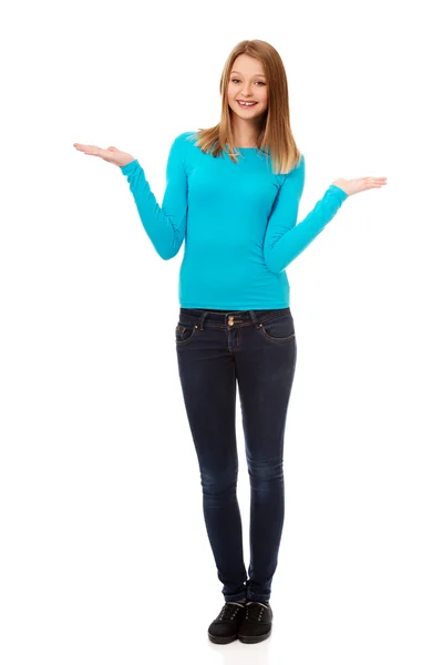 Confused woman shrugging with palms up — Stock Photo, Image