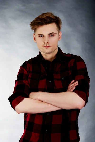 Young confident man with crossed arms. — Stock Photo, Image