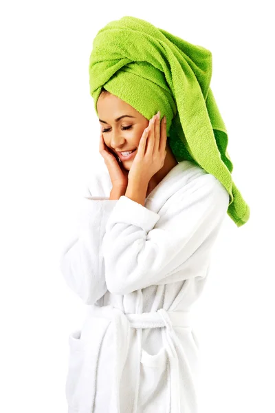 Woman in bathrobe and towel on head — Stock Photo, Image