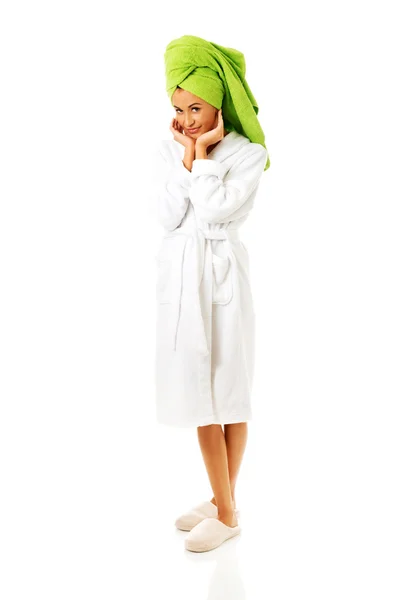 Woman in bathrobe touching face — Stock Photo, Image