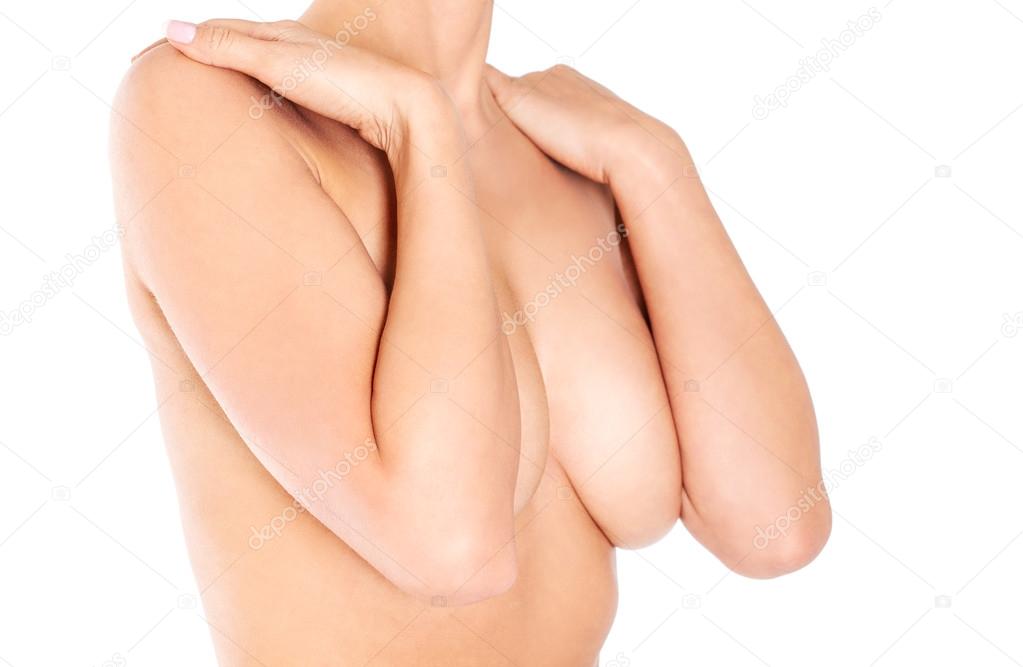 Topless woman covering her breast