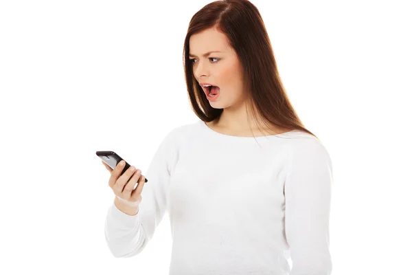 Young student woman yelling to the mobile phone — Stock Photo, Image