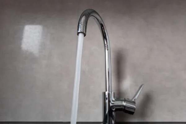 Silver faucet in bathroom — Stock Photo, Image