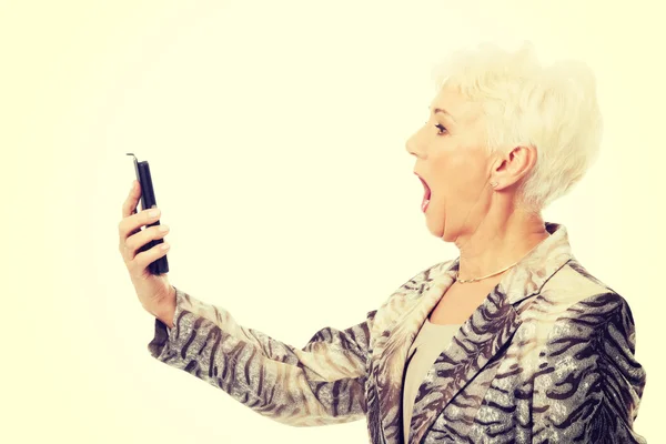 An old elegant lady using mobile phone. — Stock Photo, Image