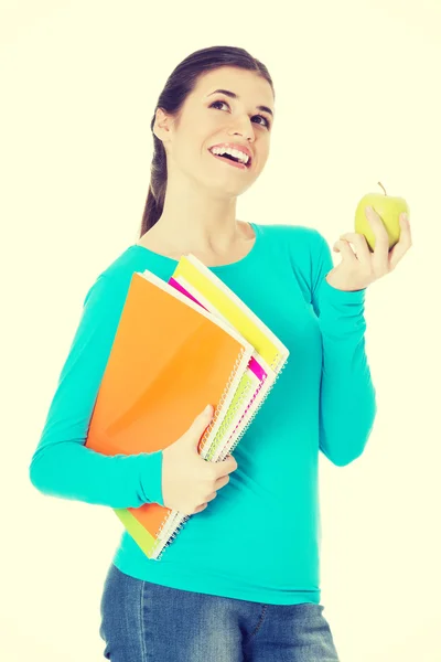 Hermosa joven estudiante con archivos y manzana . — Foto de Stock