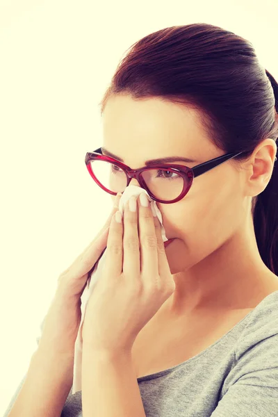 Casual beautiful woman in eyeglasses with tissue. — Stock Photo, Image