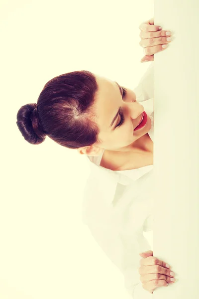 Beautiful young business woman holding copy space. — Stock Photo, Image