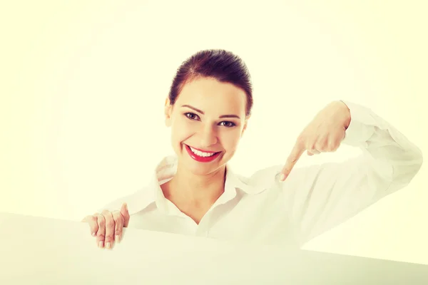 Beautiful business woman pointing on copy space. — Stock Photo, Image