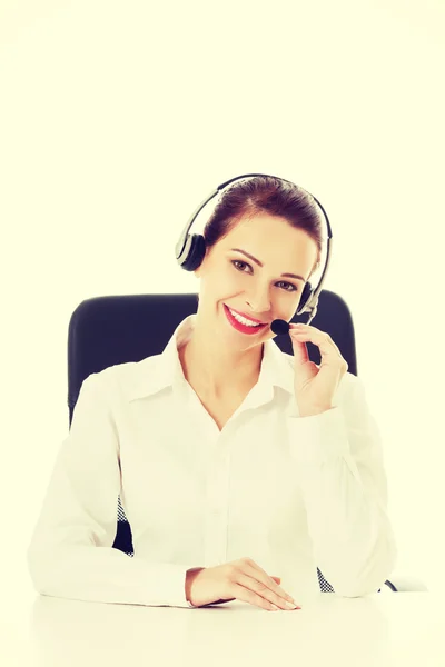 Beautiful woman sitting with microphone and headphones. — Stock Photo, Image