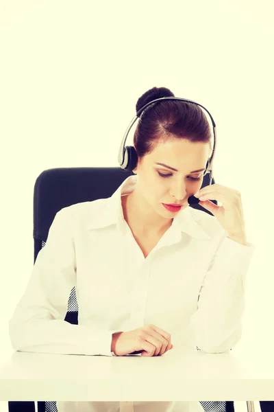 Beautiful woman sitting with microphone and headphones. — Stock Photo, Image