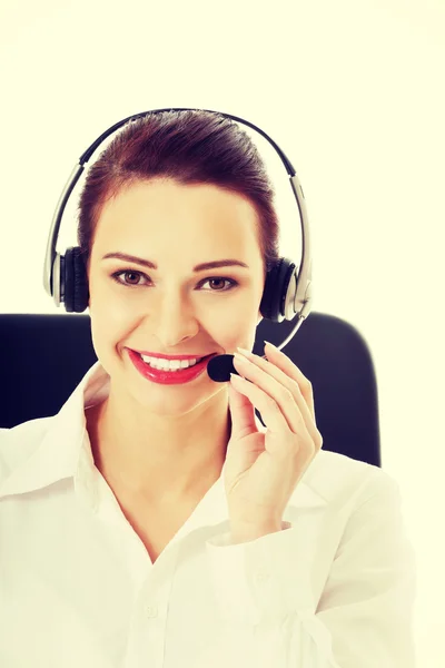 Beautiful woman sitting with microphone and headphones. — Stock Photo, Image