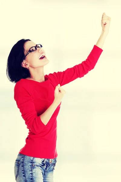 Excited young woman with fists up — Stock Photo, Image