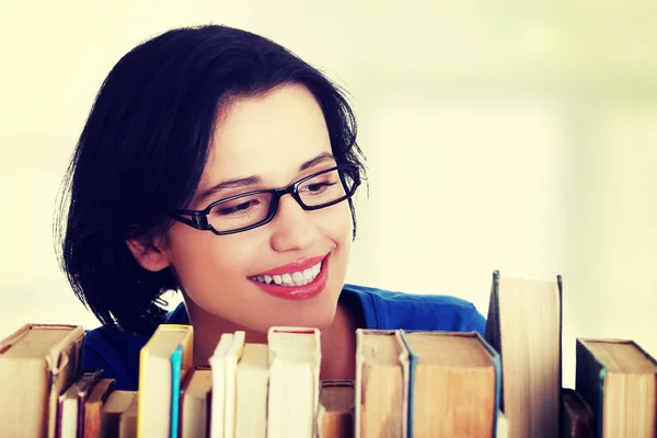 Happy smiling young student woman with books Stock Image