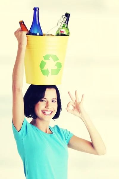 Beautiful woman holding recycling basket — Stock Photo, Image