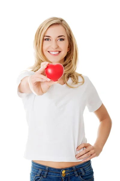 Smiling woman with red heart — Stock Photo, Image