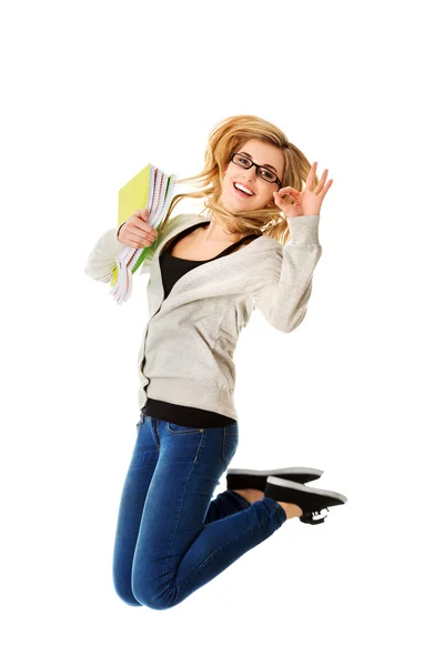 Young casual woman, student jumping. — Stock Photo, Image