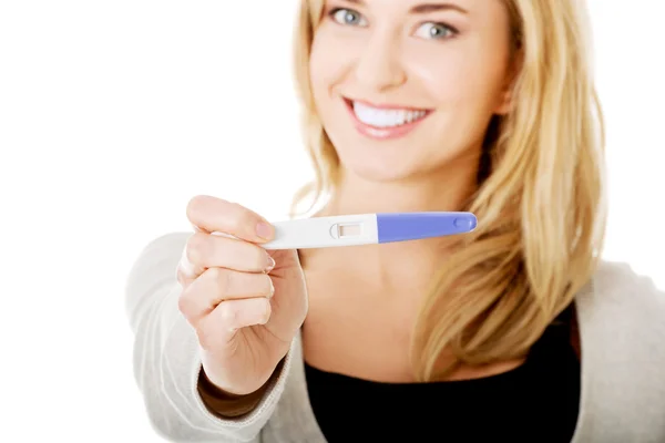 Happy woman with pregnancy test — Stock Photo, Image