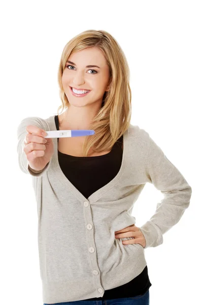 Happy woman with pregnancy test — Stock Photo, Image