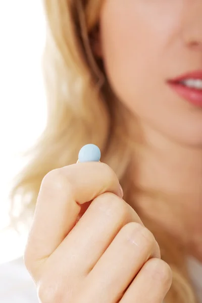 Woman with pill — Stock Photo, Image